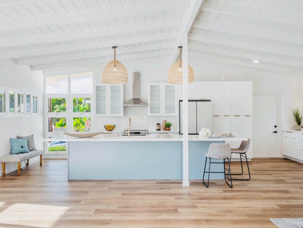 open-concept kitchen and living room featuring light wood-look Vinyl flooring | DeGraaf Interiors