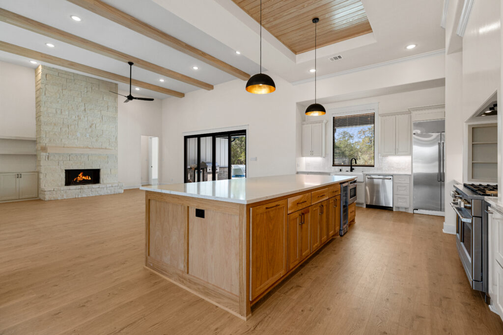 Sleek modern kitchen with durable wood-look vinyl flooring | DeGraaf Interiors