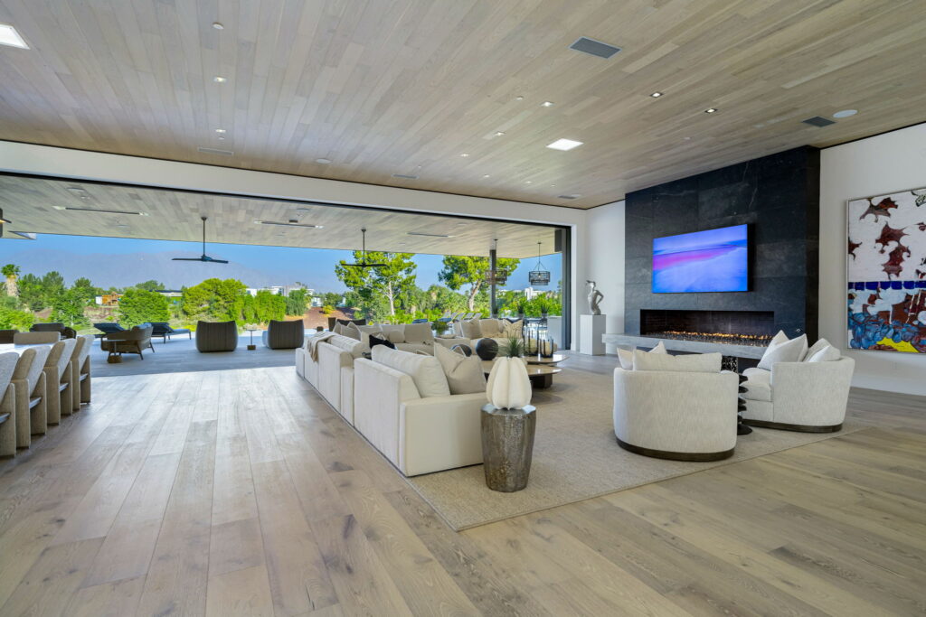 Modern living room with light vinyl plank flooring, indoor-outdoor | DeGraaf Interiors